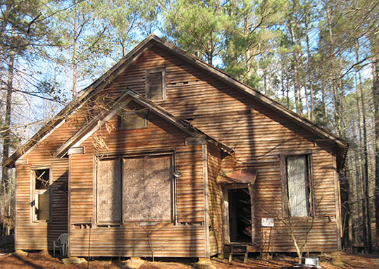The south facade of the Unity Grove Rosenwald School shows the deteriorated condition, January 23, 2023
